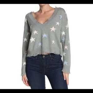Star distressed sweater